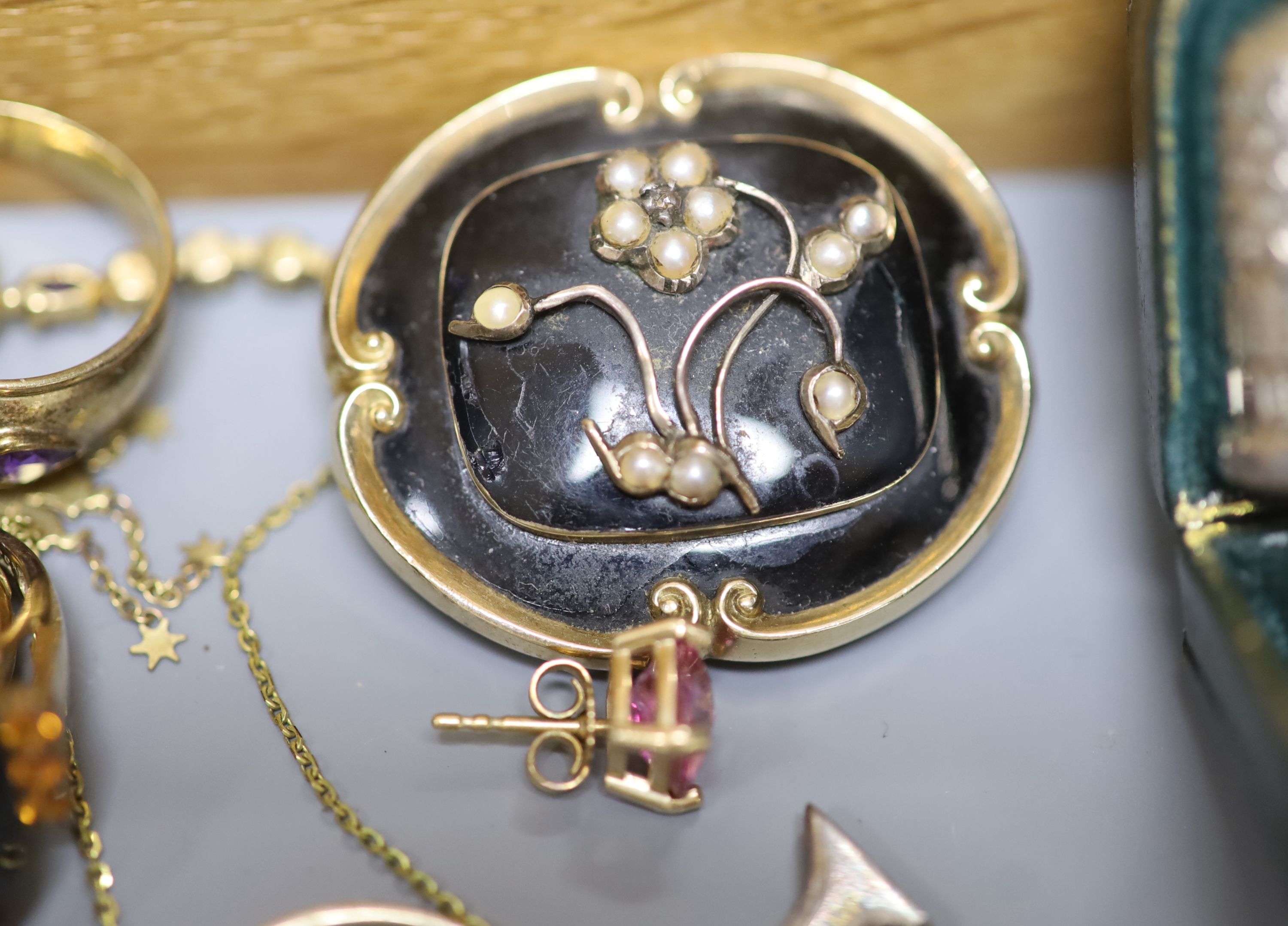 A group of assorted jewellery including two 333 yellow metal dress rings including coral set, a Victorian yellow metal, seed pearl and black enamel mourning brooch, cased silver Charles Horner thimble etc.